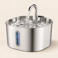 Stainless steel pet water fountain with a curved spout and blue front window